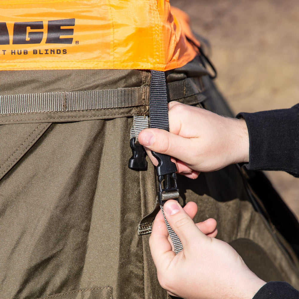 CAGE Blaze Orange Safety Cap improving visibility for hunters in brush