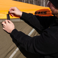 CAGE Blaze Orange Safety Cap folded compact for storage and transport