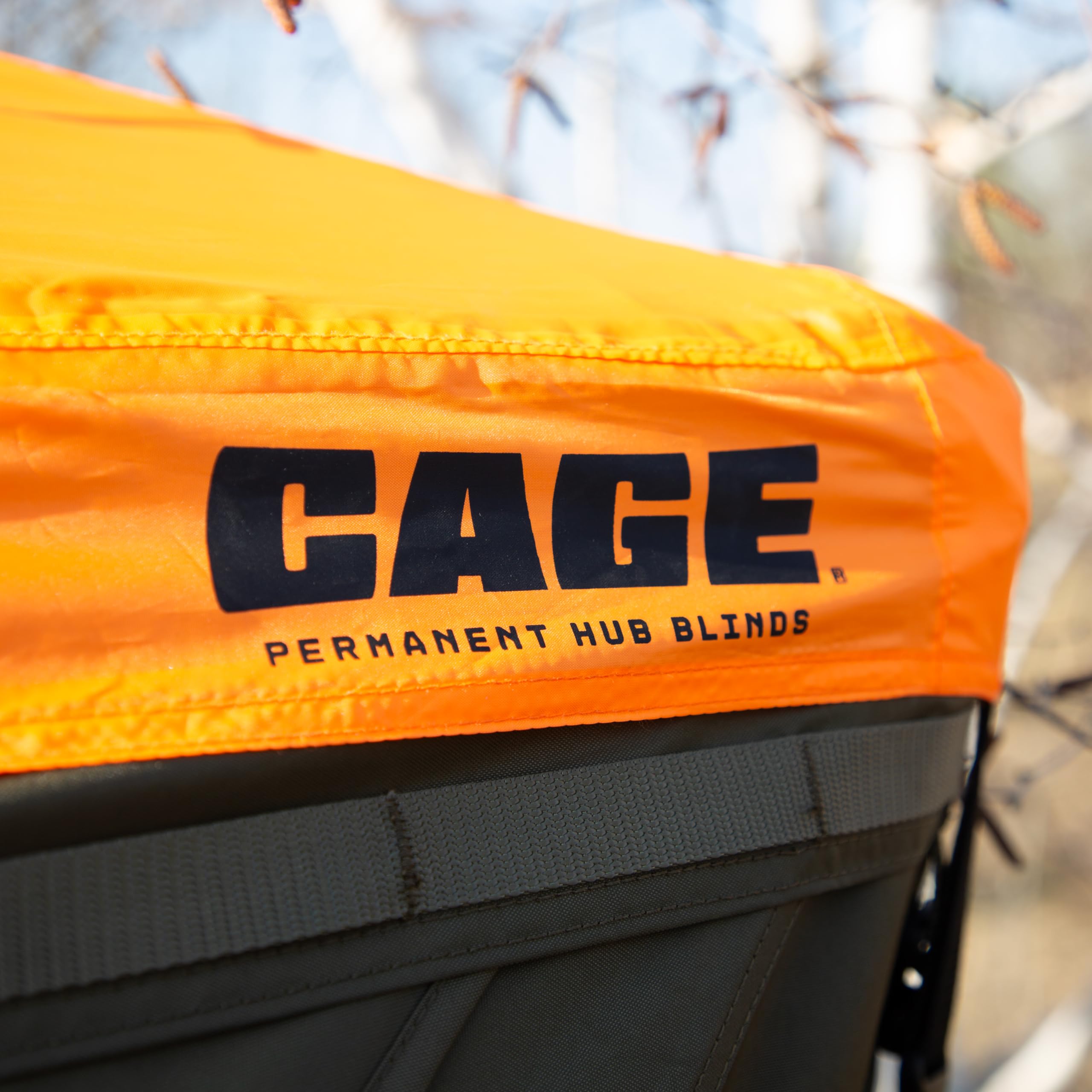 CAGE Blaze Orange Safety Cap installed on hub blind, ready for safer hunts