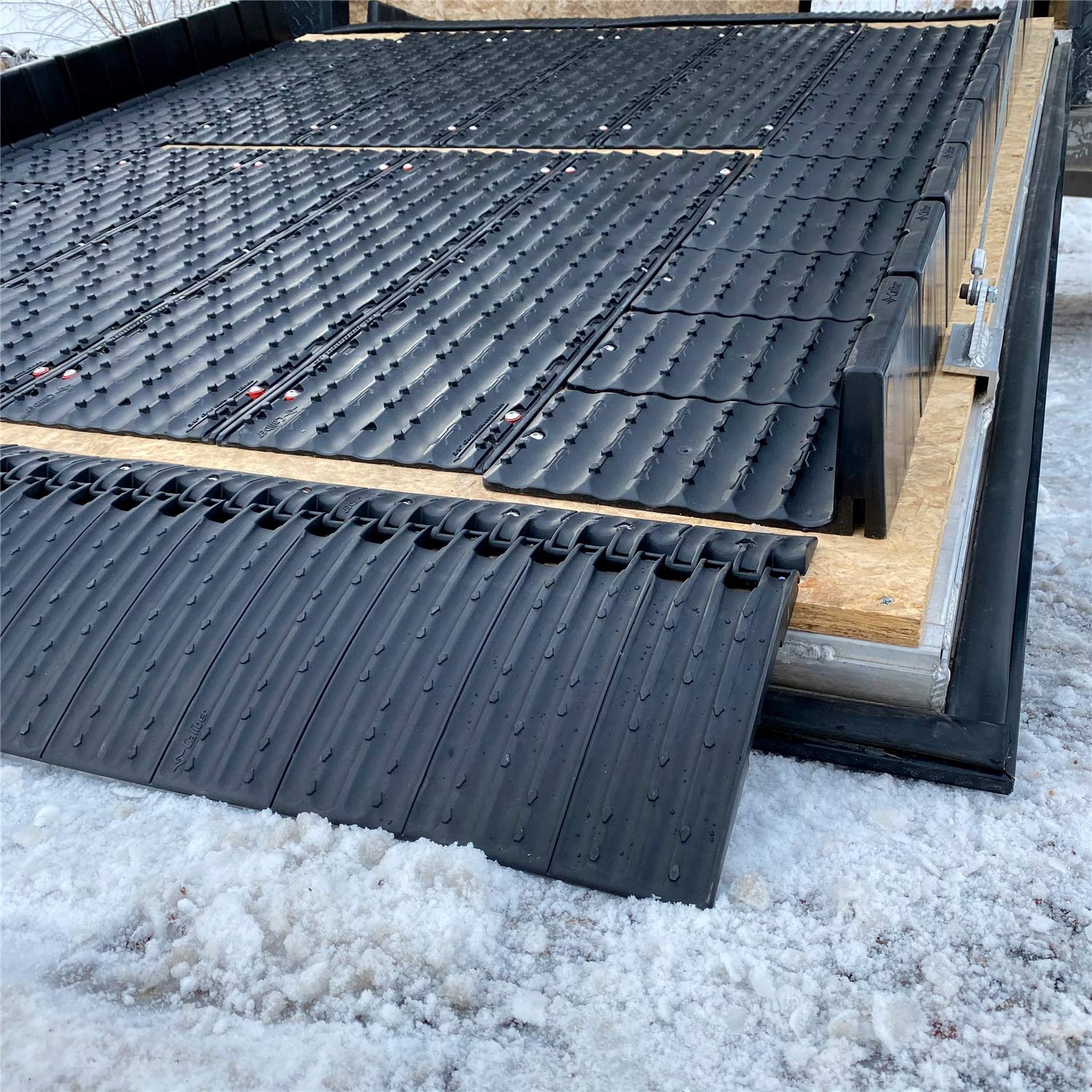 Caliber Lowpro Grip Glides 13387 loading a snowmobile onto a trailer.