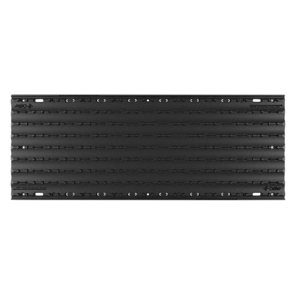Caliber Lowpro Grip Glides four-pack laid on a trailer deck for versatile powersport loading.