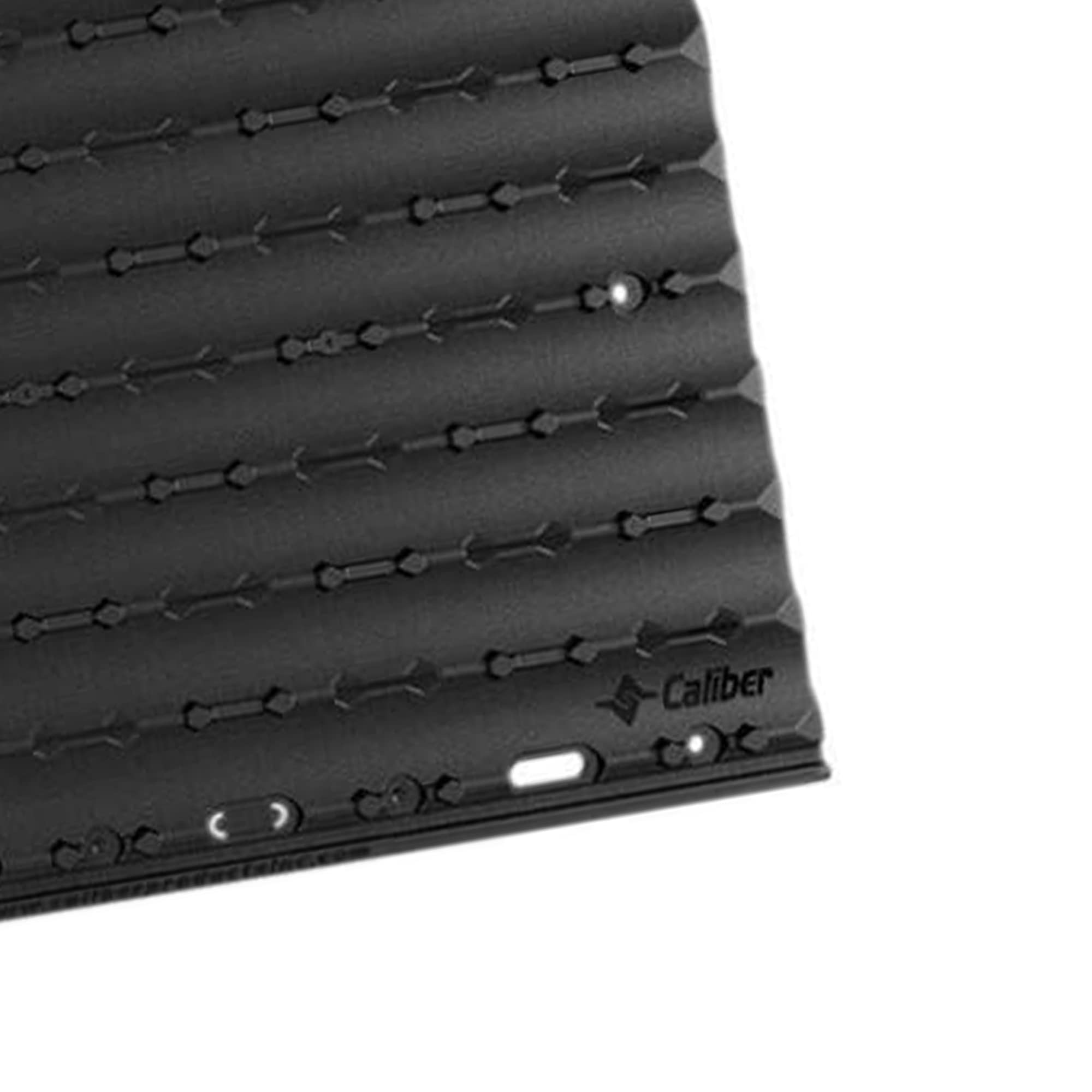 Caliber Lowpro Grip Glides on a metal surface highlighting durable USA-made quality.