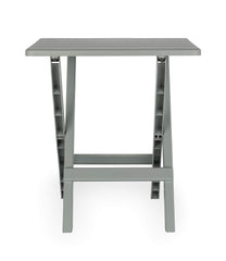 Camco 51692 gray Adirondack side table at the beach setup, weatherproof for outdoor use.