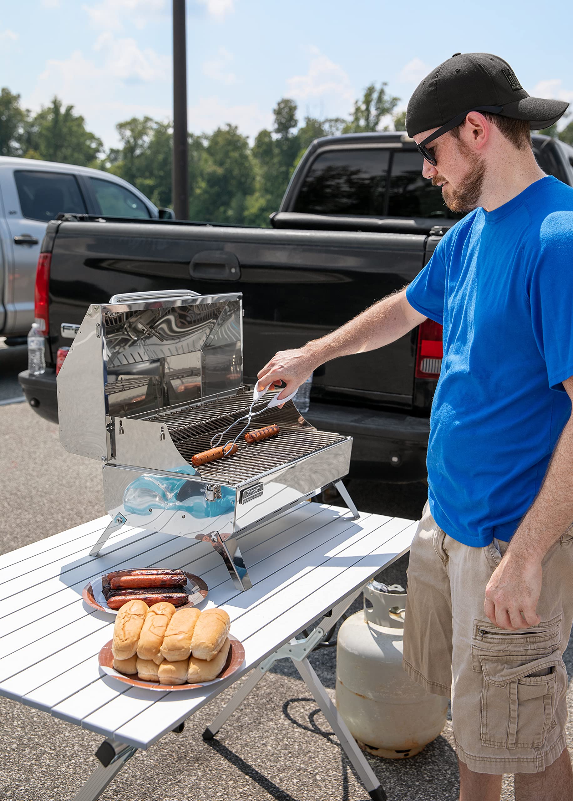 Camco roll-up table assembly shows convenient cross bar supports for quick setup.