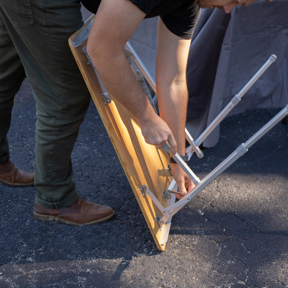 Camco adjustable-height table (18–26 inches) supports flexible outdoor use.