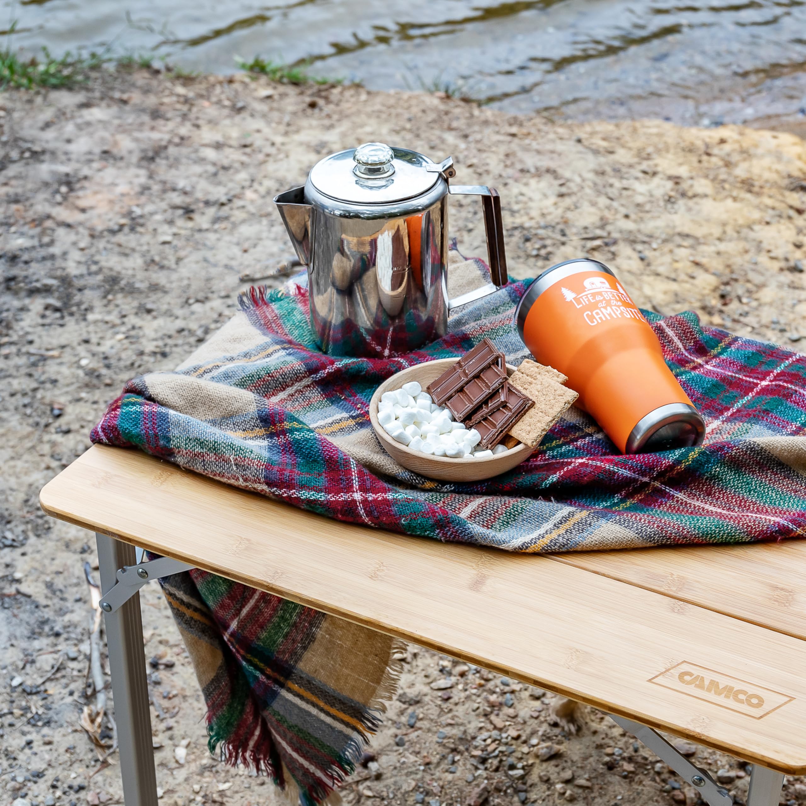 Camco folding table in tailgating setup ready for snacks
