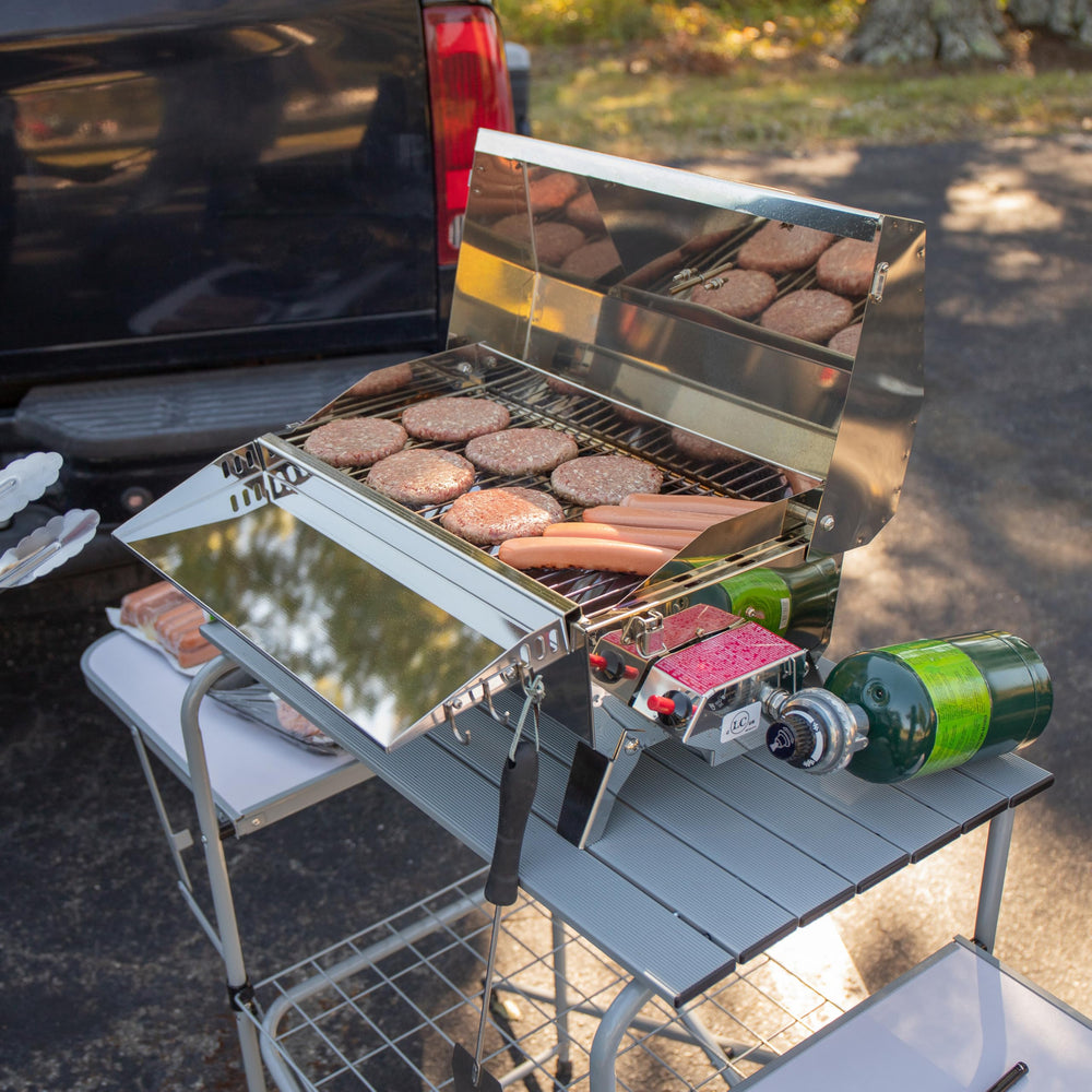 Camco Olympian Deluxe table lower storage shelf keeps gear organized.