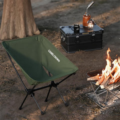 CAMEL CROWN folding chair opened on a beach for easy seating.
