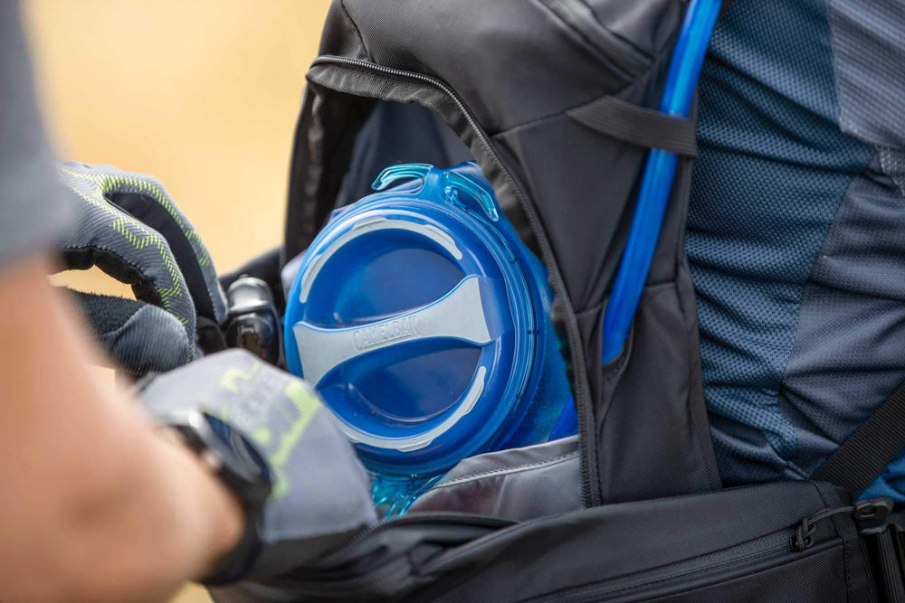 CamelBak Crux 1.5L reservoir compact fit in backpack.