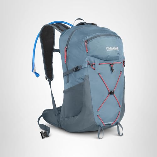 CamelBak Fourteener 24 worn on trail with reflective accents for visibility.