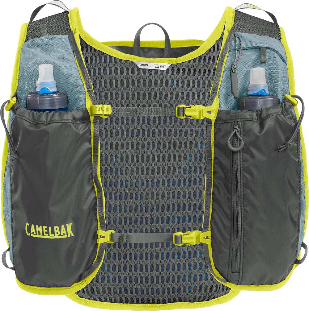 CamelBak Women's Circuit Run Vest trekking pole attachment on rugged terrain