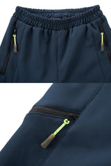 CAMLAKEE kids waterproof hiking pants navy interior fleece lining for cozy warmth on chilly hikes.