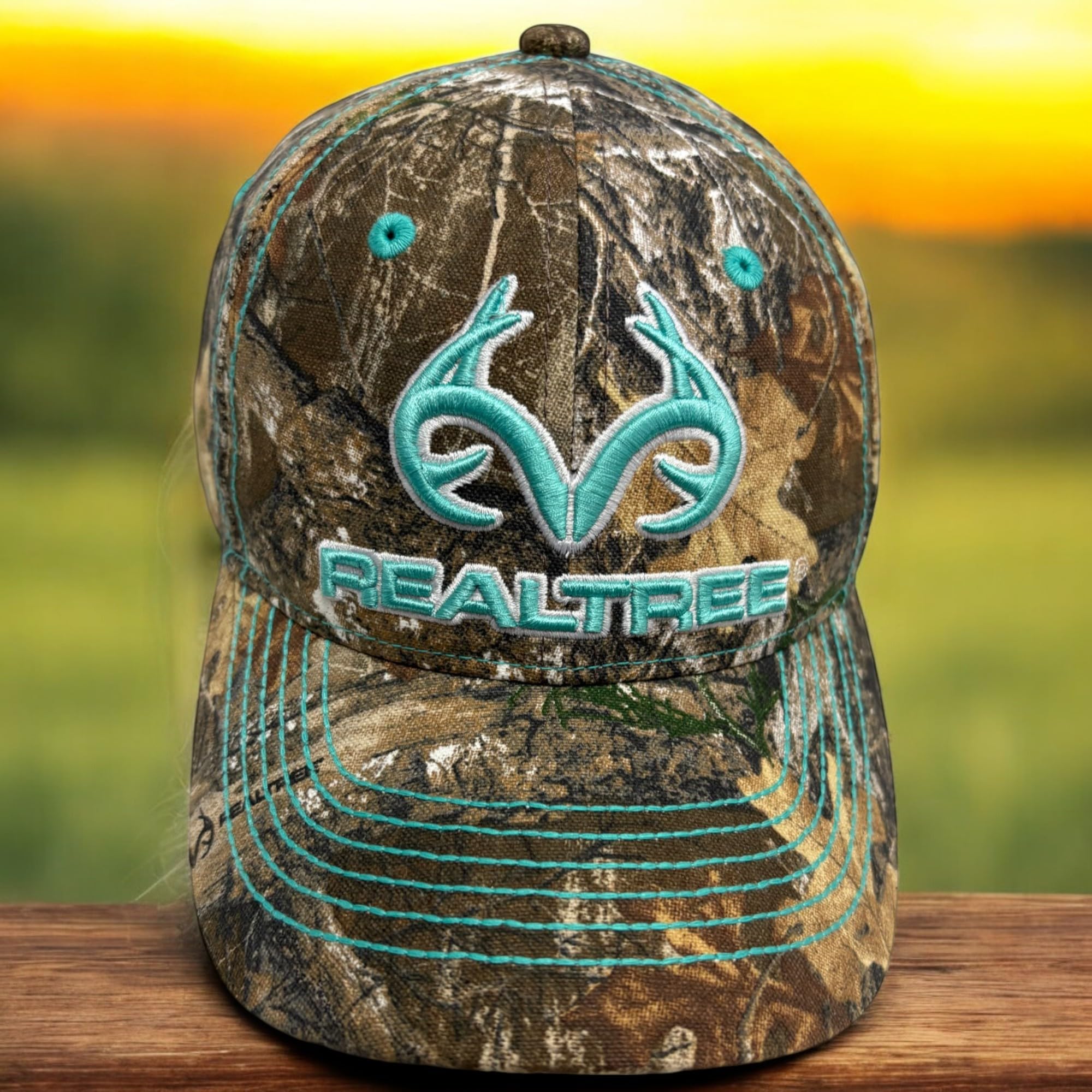 Camo Chique Realtree camouflage detail on teal cap for versatile wear