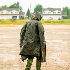 CamoOutdoor Mil-Tec poncho bivy-sack-use shows emergency shelter capability in survival situations.