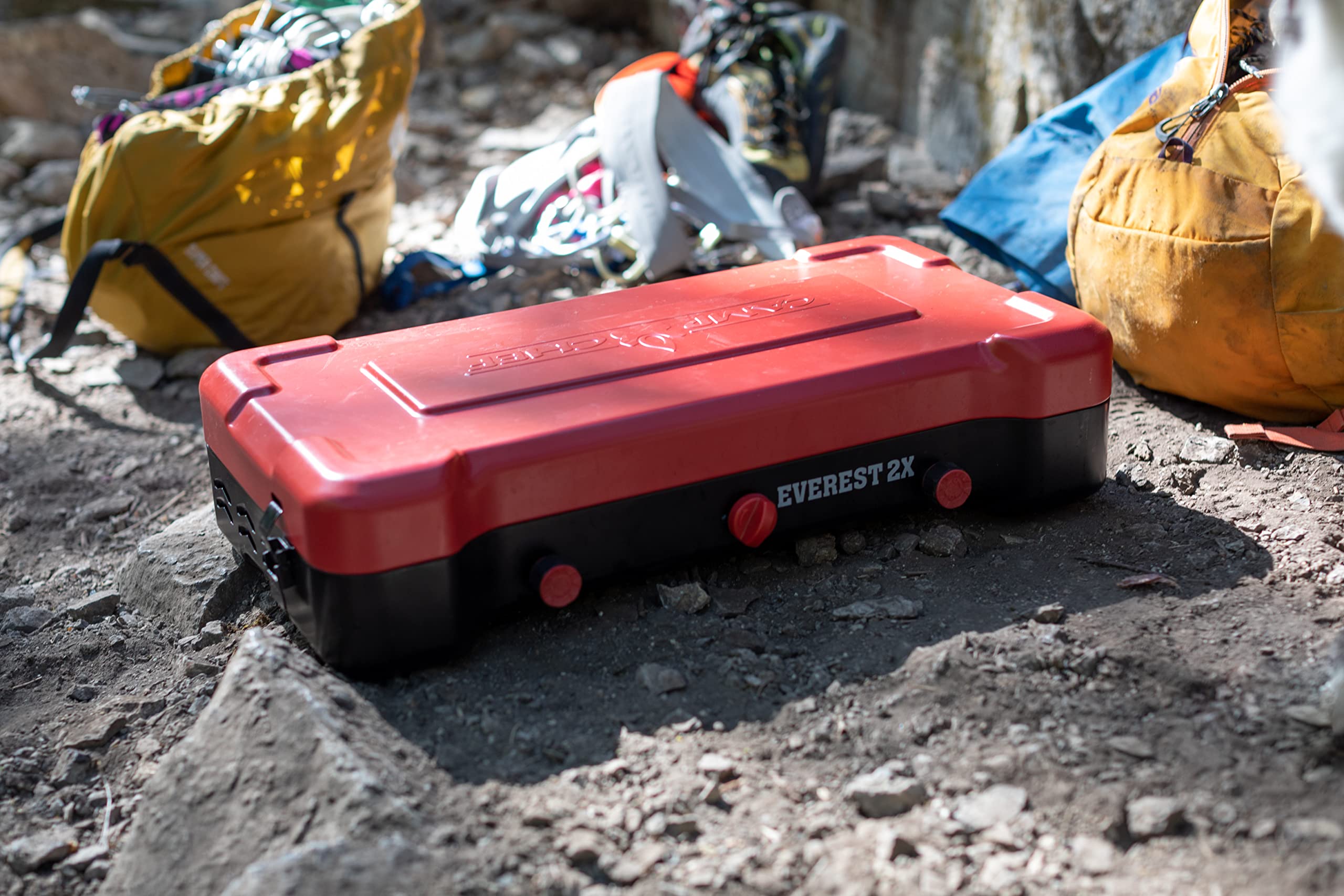 Camp Chef Everest 2X folding lid windguard showcases portable, wind-resistant setup.