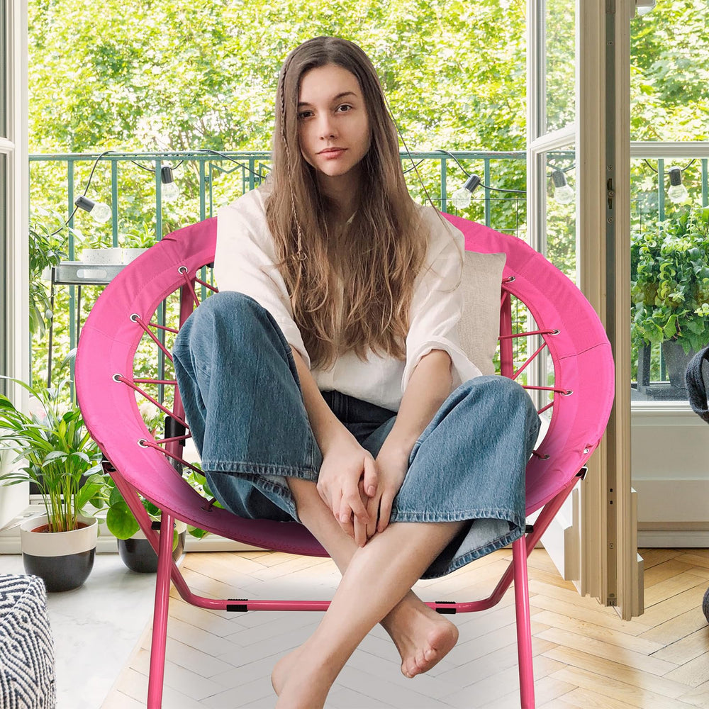 CAMP SOLUTIONS bungee chair pink folded for easy storage.