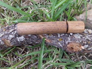 CampfirePiston Hickory Fire Piston char cloth bundle enables quick ignition readiness.