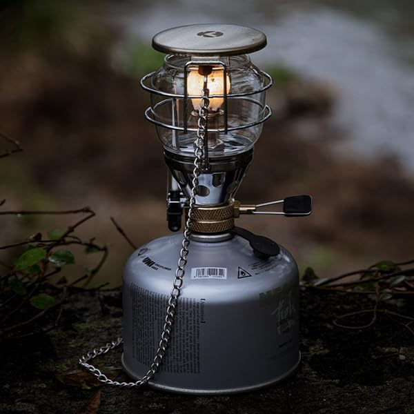 Camping Moon camping gas lantern T-4 glow enhances evening outdoor ambience.