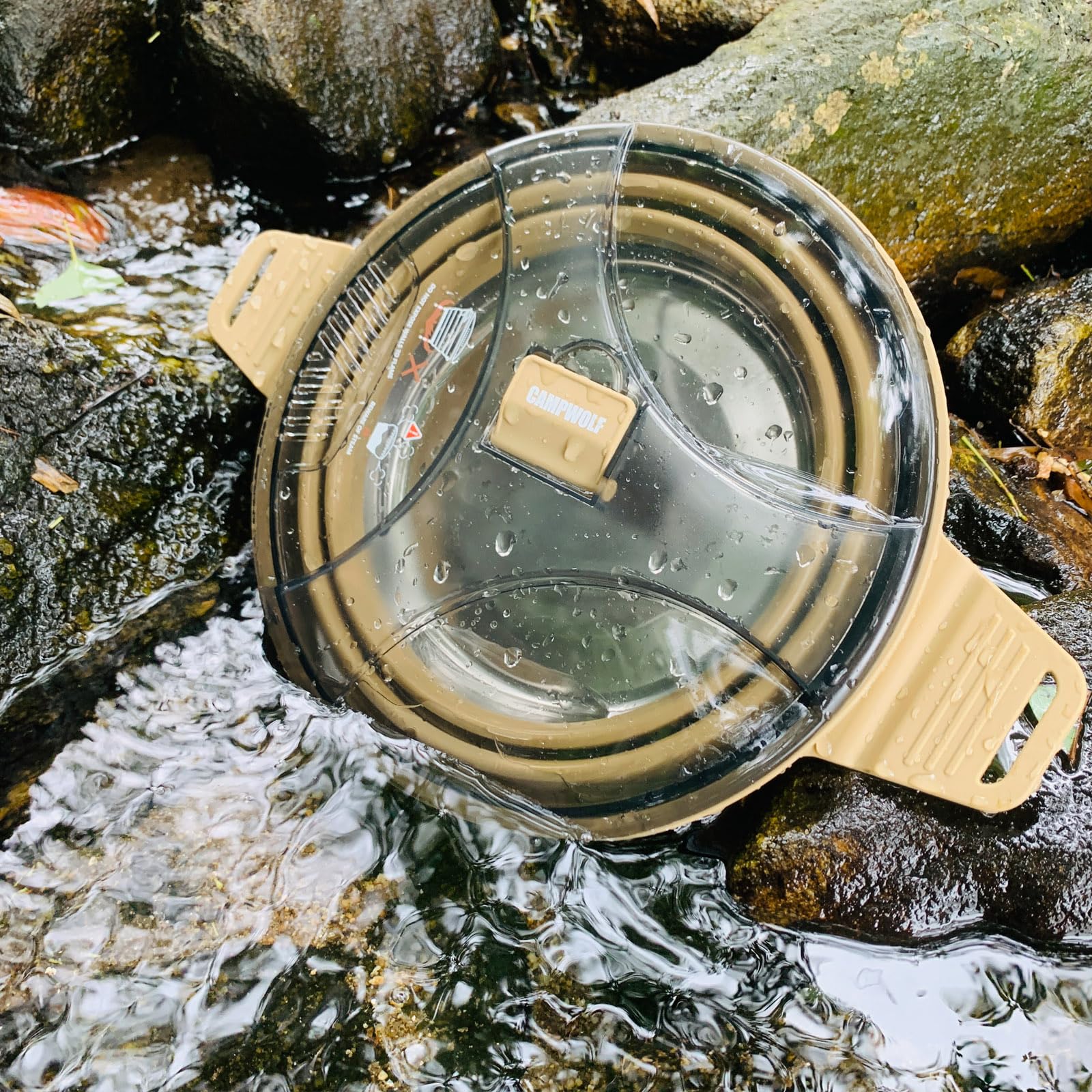 CAMPWOLF collapsible pot lid with strainer for draining liquids at campsite.