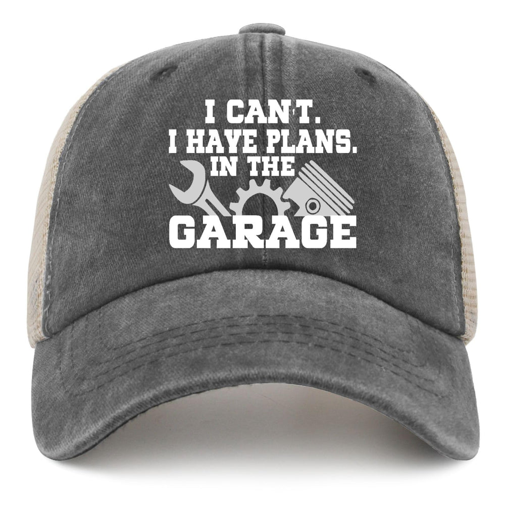 Model wearing the hat in a garage setting