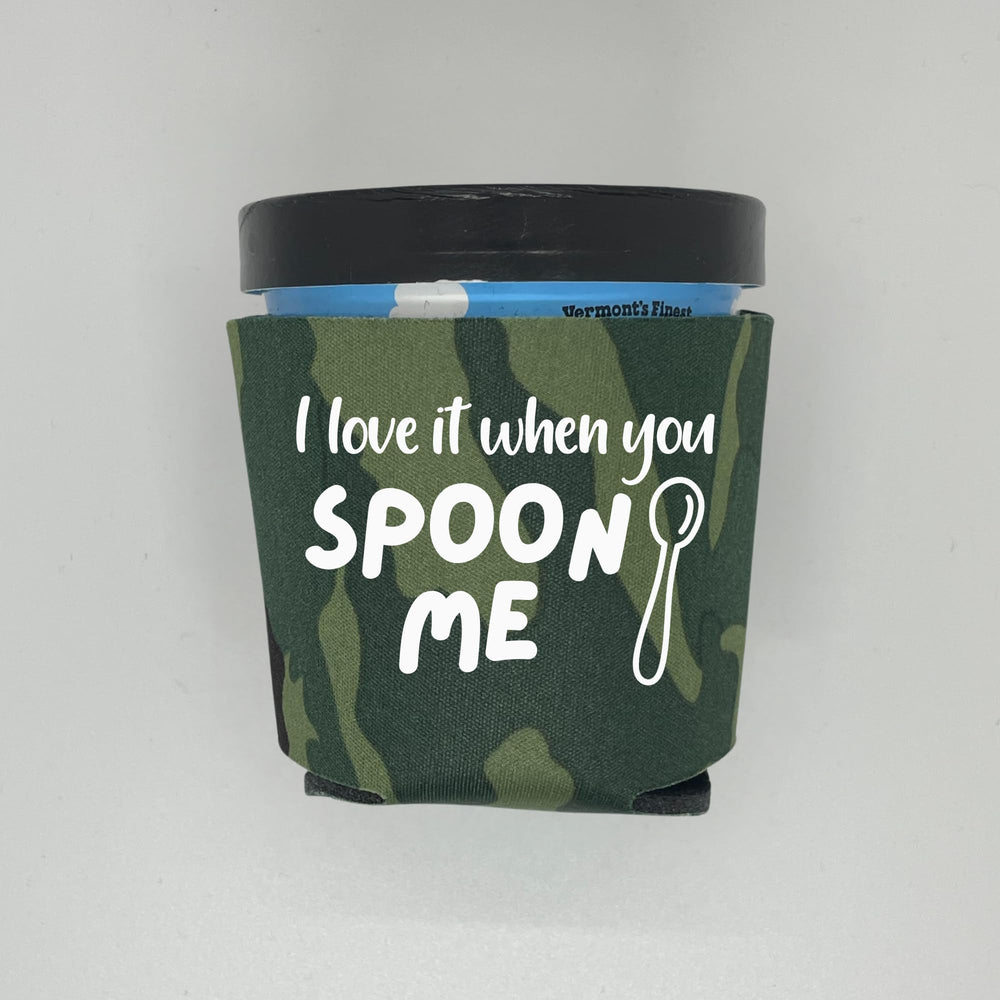 Capital City Commerce green camouflage foam holder shown collapsed for easy storage.