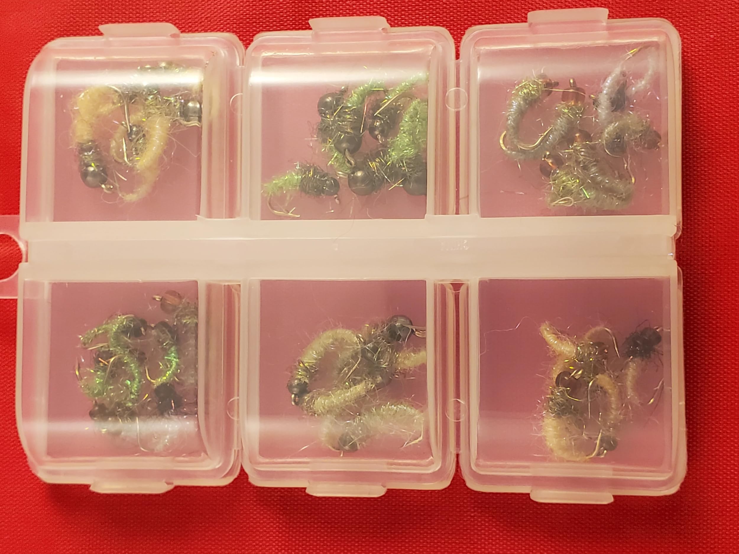 Capt. Ken's Ice Caddis color selection including green and peacock