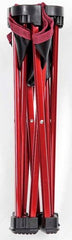 Compact red Captain Stag chair folded in its storage bag for travel