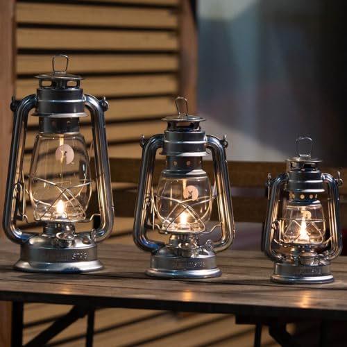 Captain Stag UK-513 CS Oil Lantern lit at campsite showing warm glow.