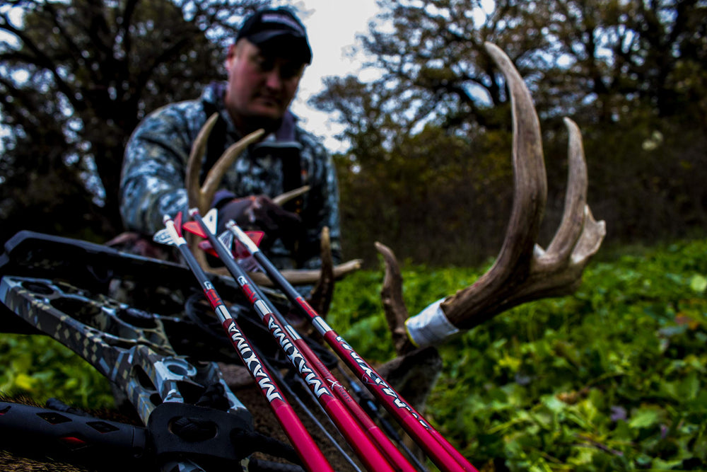 Carbon Express Maxima Red SD black-red graphics improve field visibility and tracking.