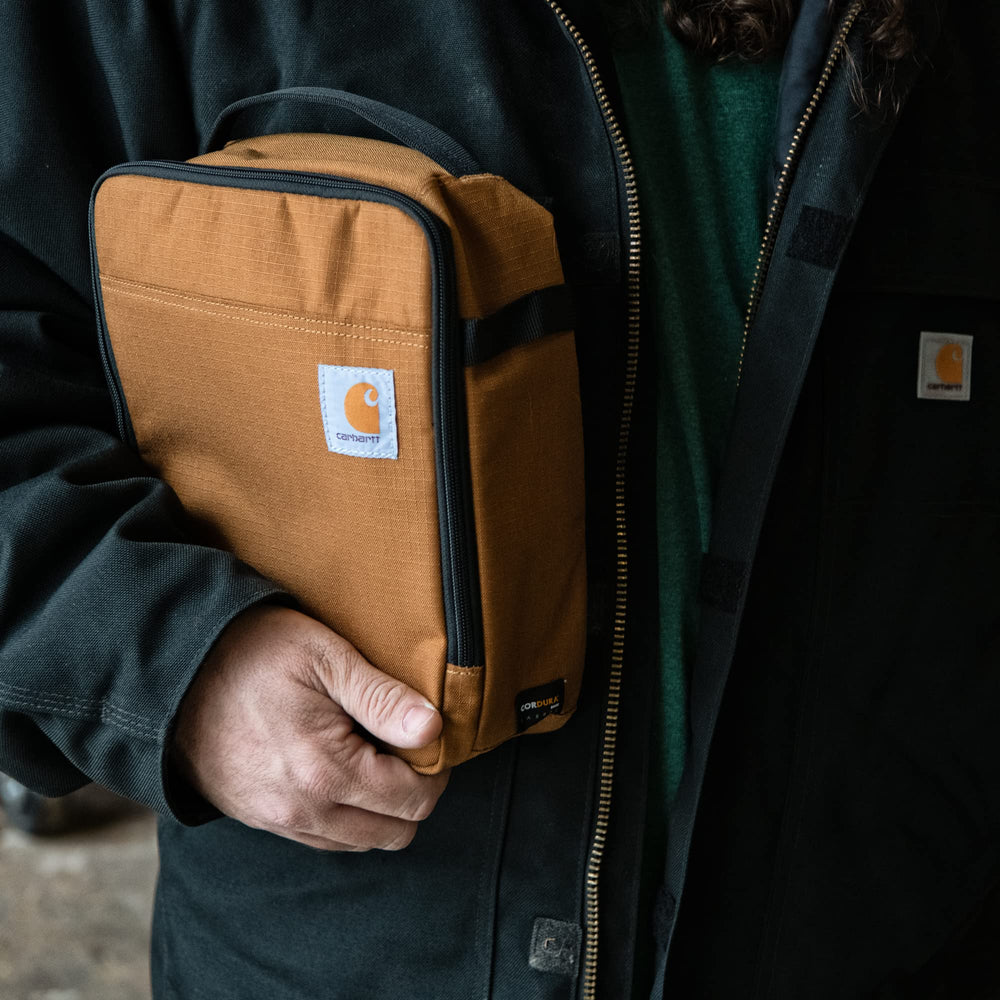 Interior ice-pack pocket inside Carhartt cooler bag for stable cooling