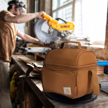 Carhartt lunch box spacious interior fits containers, snacks, and drinks.