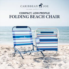 Caribbean Joe folding beach chair on sand offers low-profile seating for relaxed shoreline lounging.