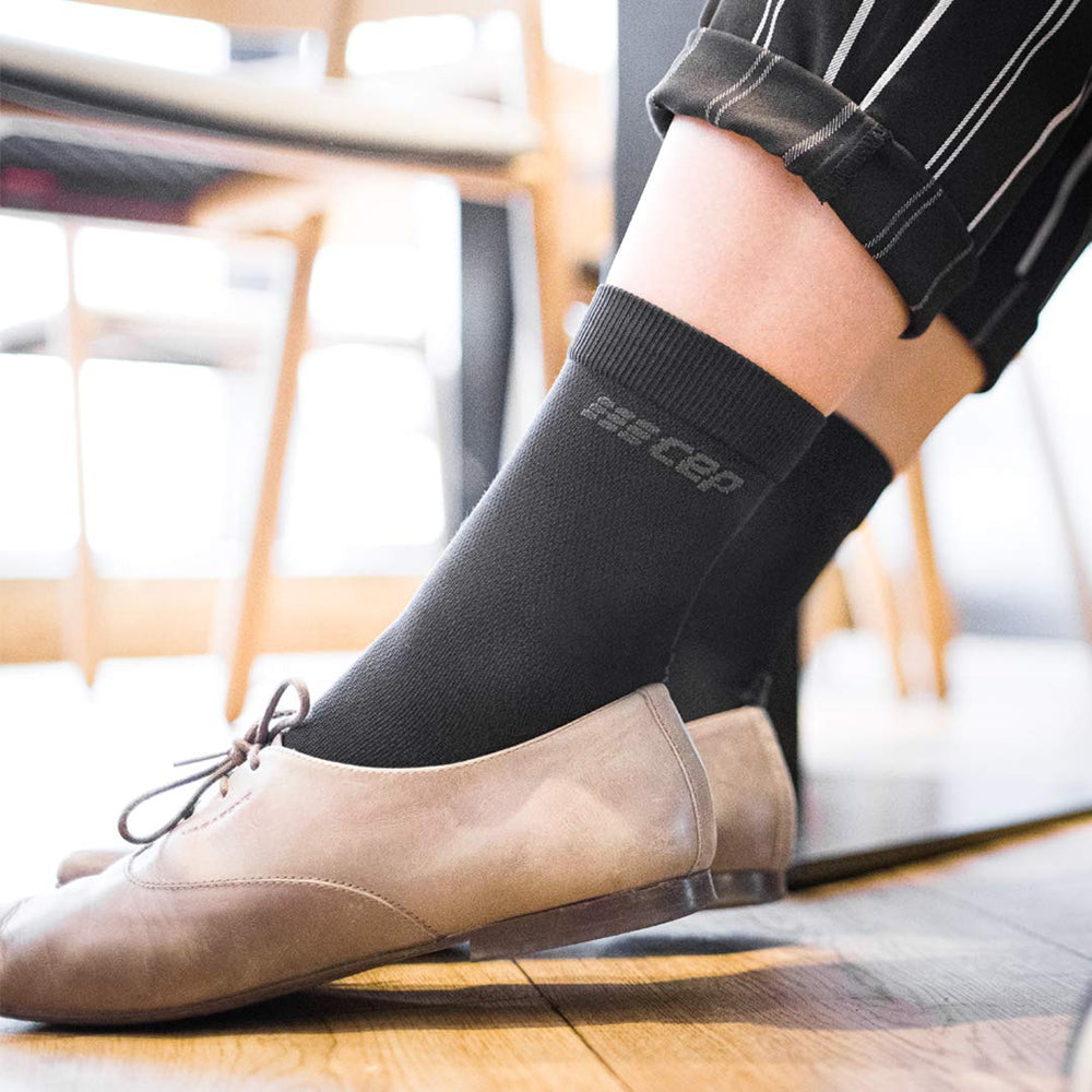 CEP Merino socks in travel setting ready for long days of activity