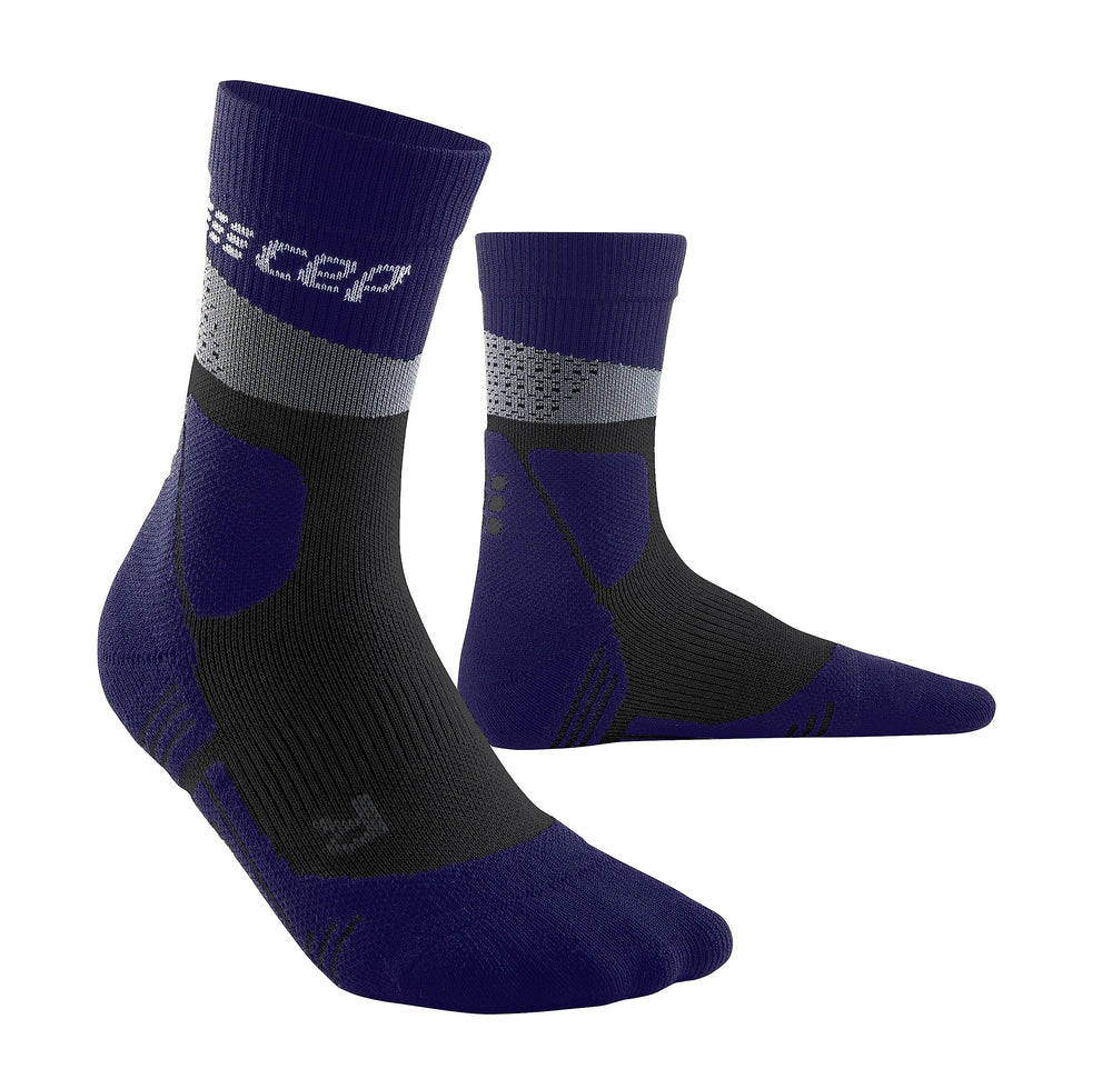 CEP Max Cushion hiking mid-cut socks in grey and black worn on trail-ready foot for all-day comfort.
