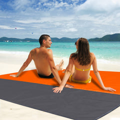 CEREM Beach Blanket XL compact orange packs into its storage bag.