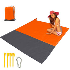 CEREM Beach Blanket XL folded orange for easy transport.