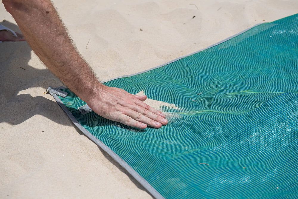 CGEAR Original Sand-Free Outdoor Rug with reinforced D-ring corners for secure staking