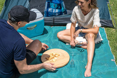 CGEAR Original Sand-Free Outdoor Rug close-up demonstrates dirt filtering through the weave