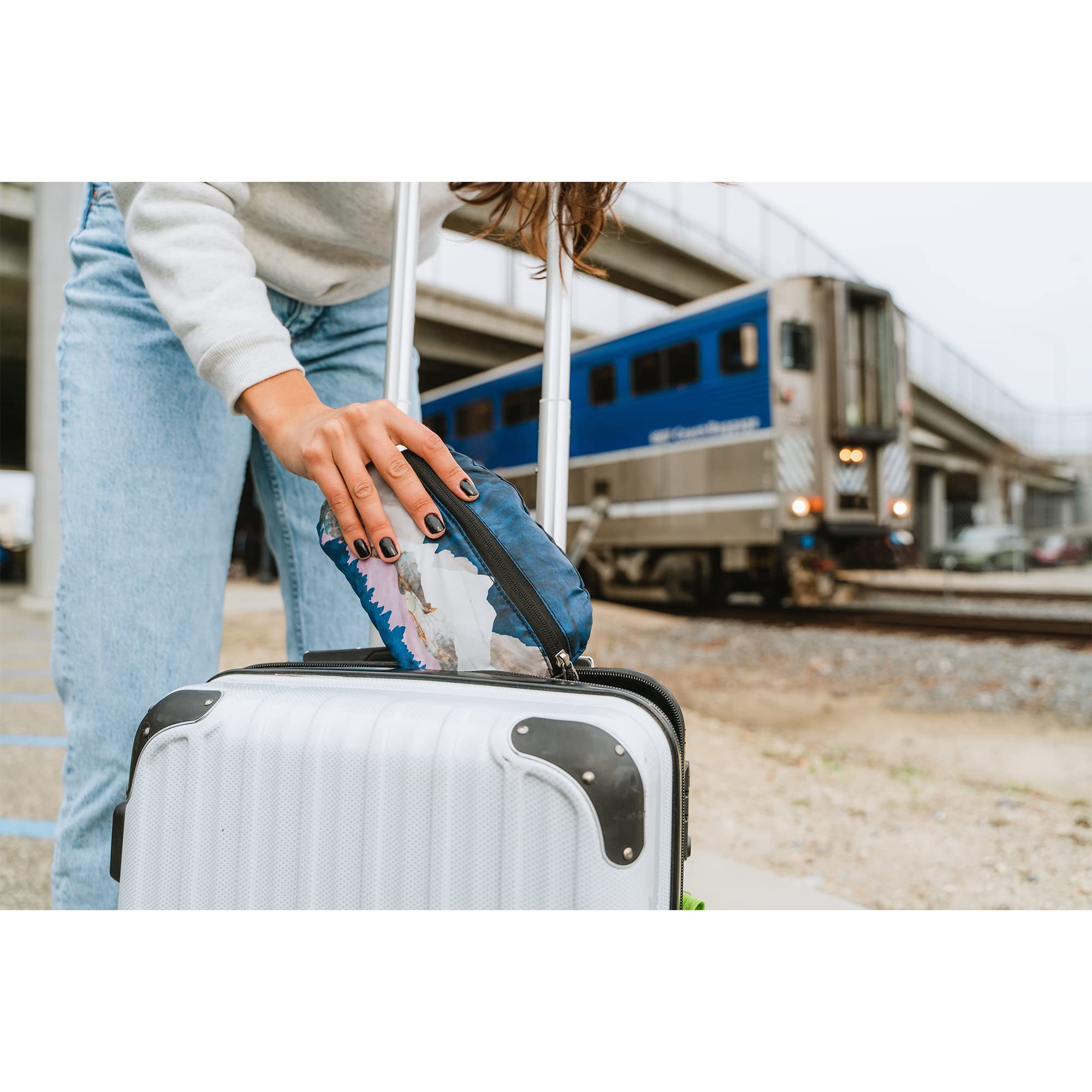 ChicoBag Travel Pack repete in-use on a hiking trail as an eco-conscious reusable option.