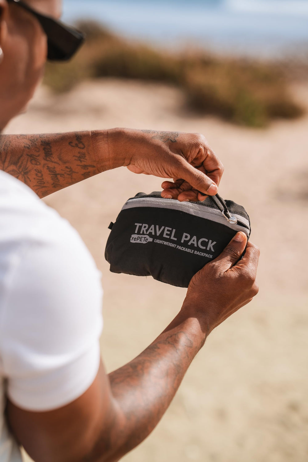 ChicoBag Travel Pack rePETe + Refine Sapphire hydration reservoir area for on-the-go hydration.