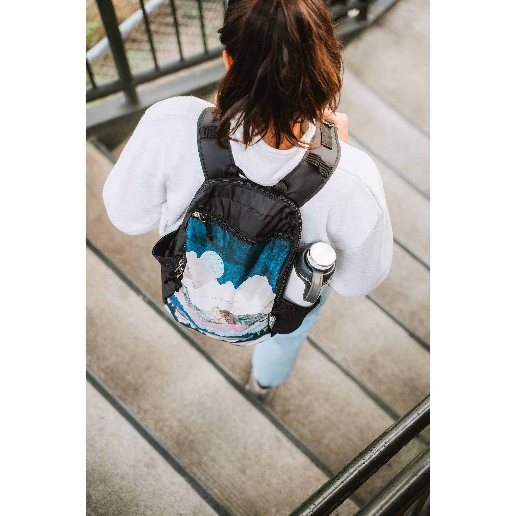 ChicoBag Travel Pack repete worn on the shoulder during hikes for convenience.