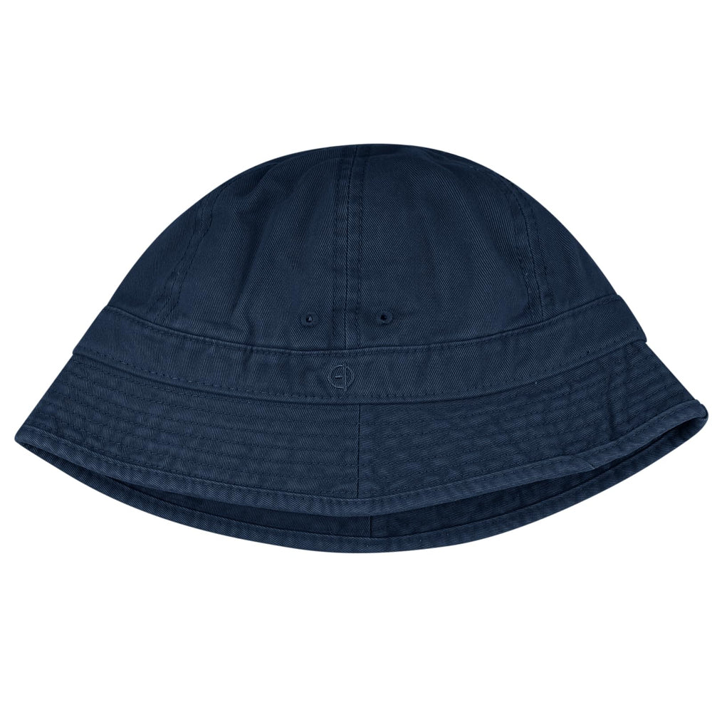 Lifestyle shot: blue Clakllie packable hat worn outdoors