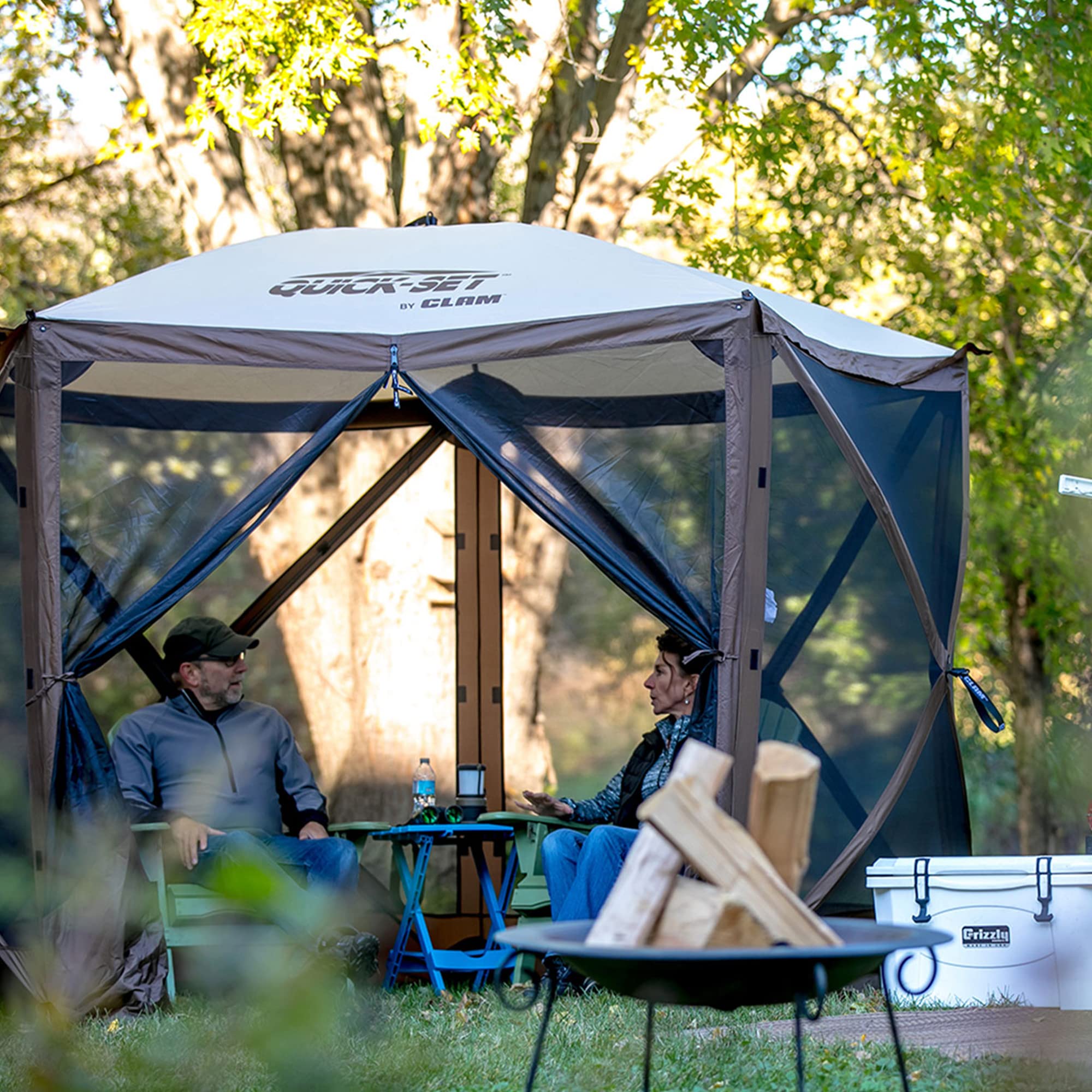 CLAM Pop Up Screen Tent 9x9 stakes and tie-downs ensure secure setup.