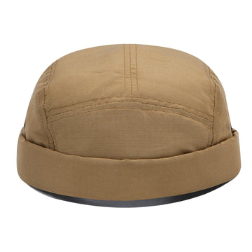 Lifestyle shot of CLAPE brimless cap in outdoor setting