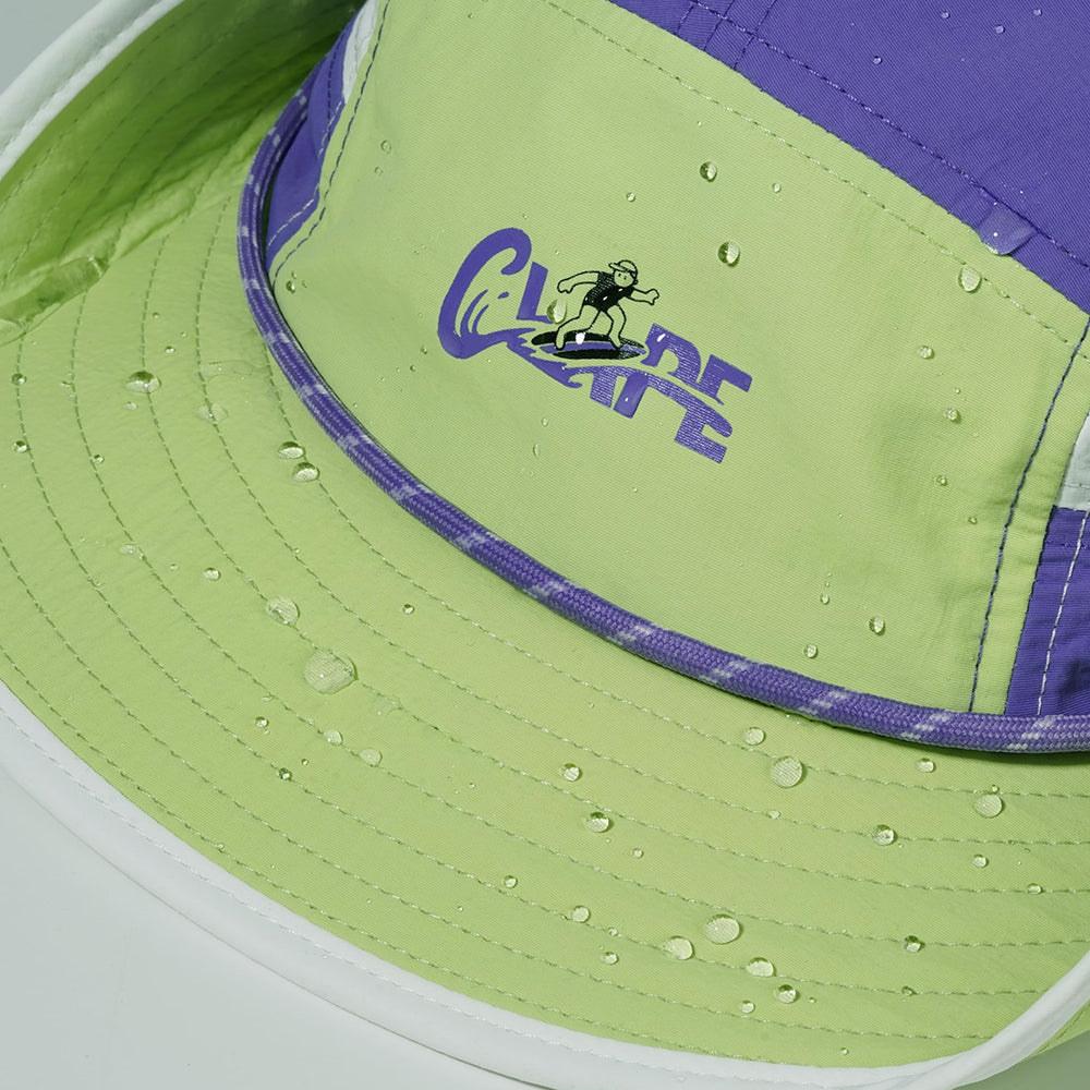 Model wearing CLAPE Surf Hat during surfing