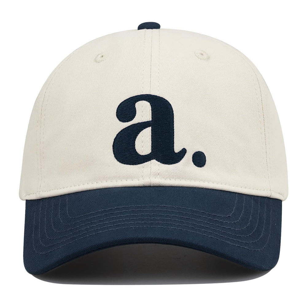 Side view showing color-block two-tone design and curved brim