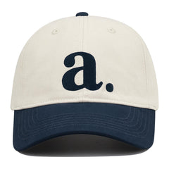 Side view showing color-block two-tone design and curved brim