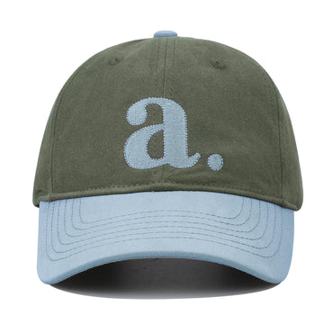 Front view of CLAPE cap showing color-block two-tone design and embroidery