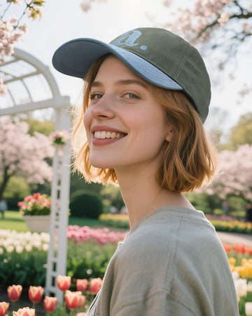 Side view highlighting adjustable metal buckle on CLAPE two-tone cap