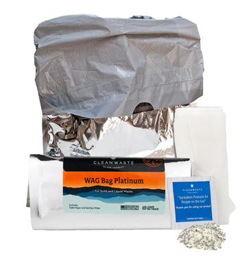 Cleanwaste Wag Bag Platinum kit open showing contents for portable sanitation.